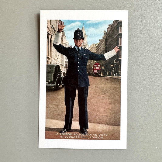 Vintage-style photo of a London policeman on duty in Ludgate Hill, London.