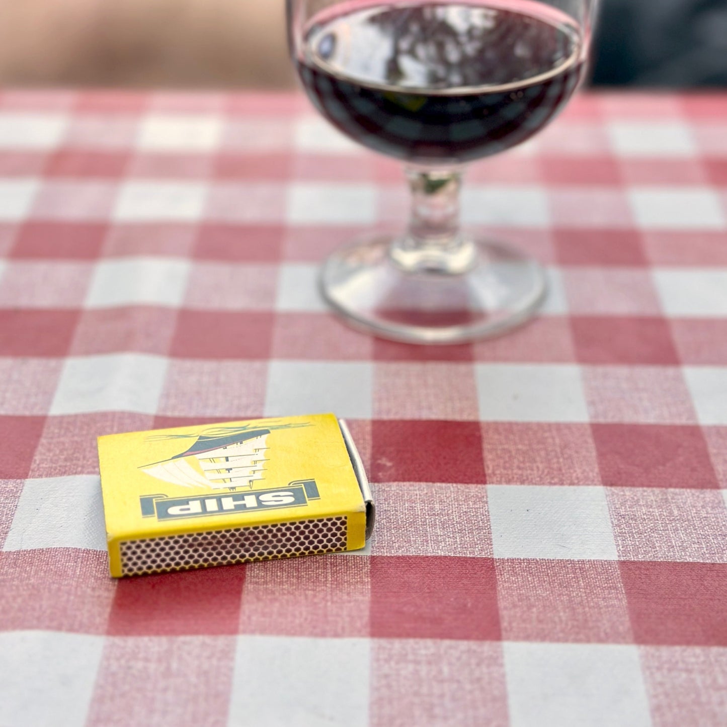 PVC table cloth gingham outdoors glass of wine