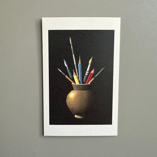 Poster of a still life with a vase containing colorful paintbrushes on a gray wall.