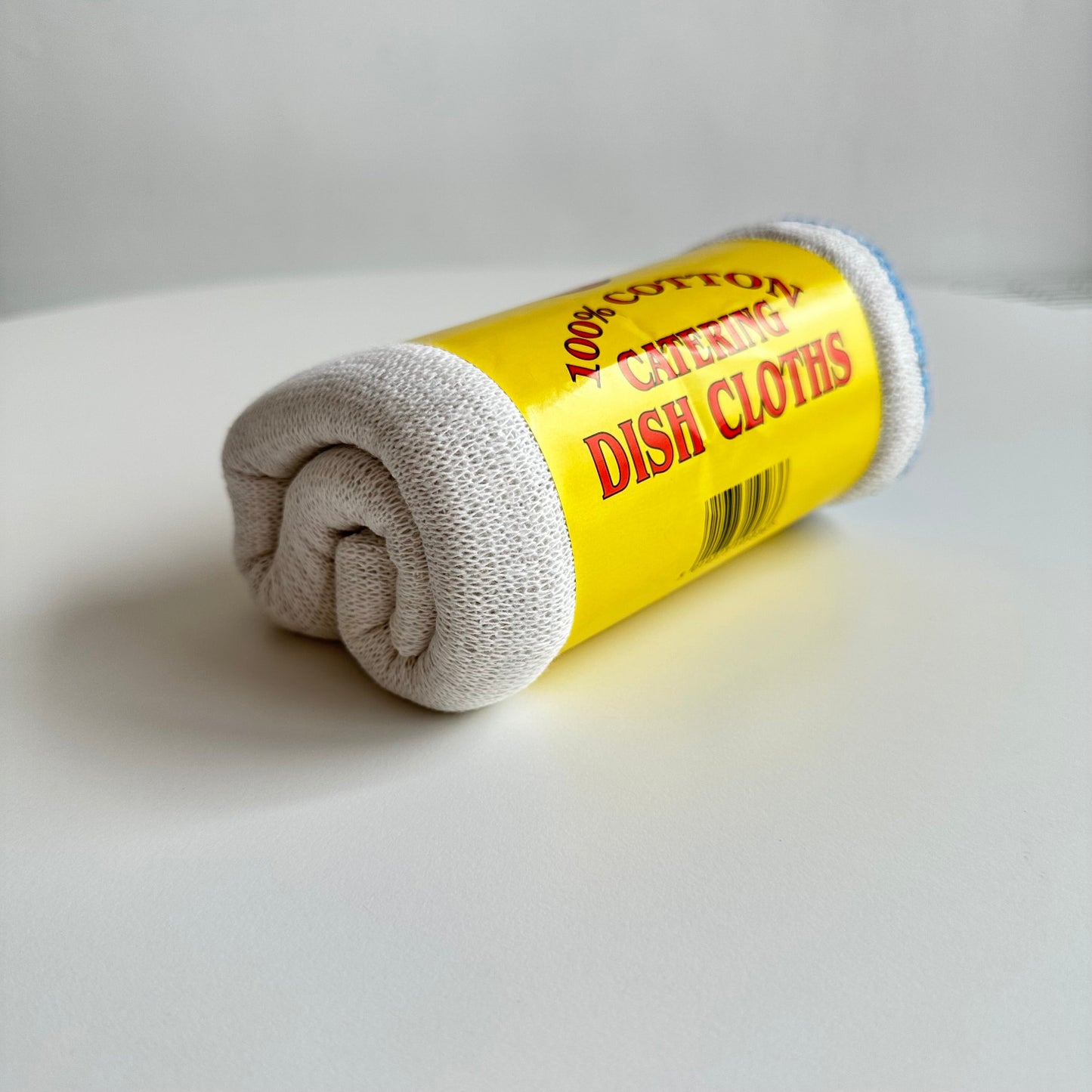 Detail of roll of dish cloths white background