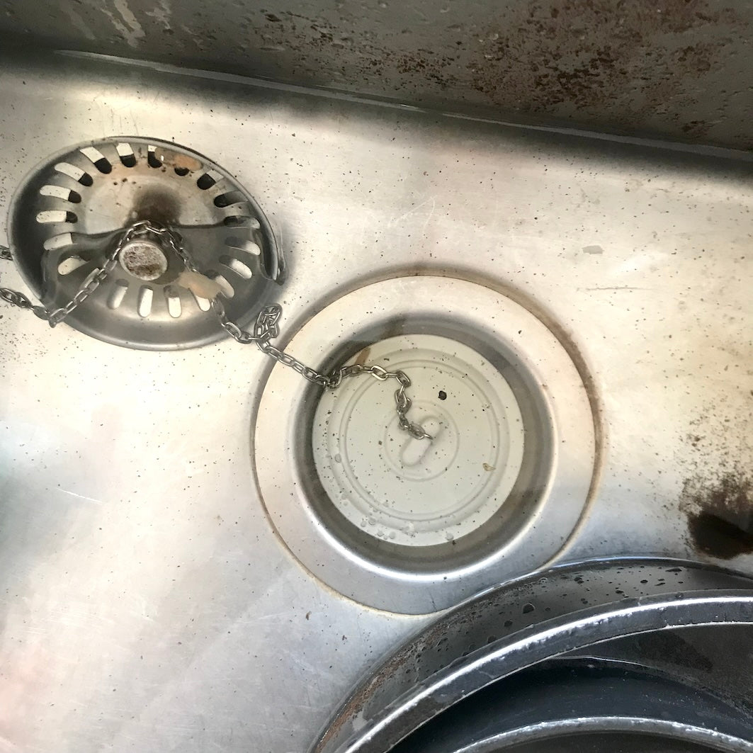Universal bath and sink plug
