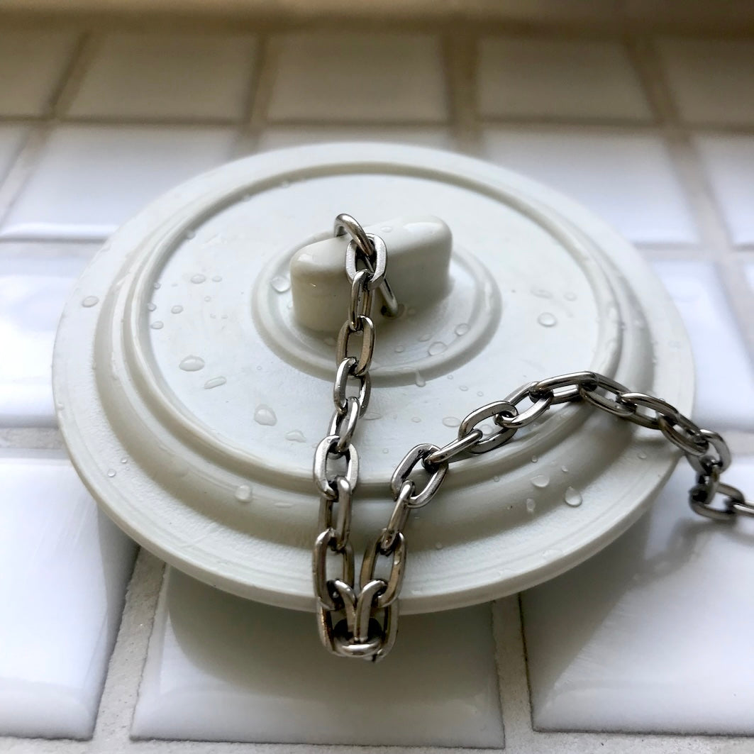 Universal bath and sink plug