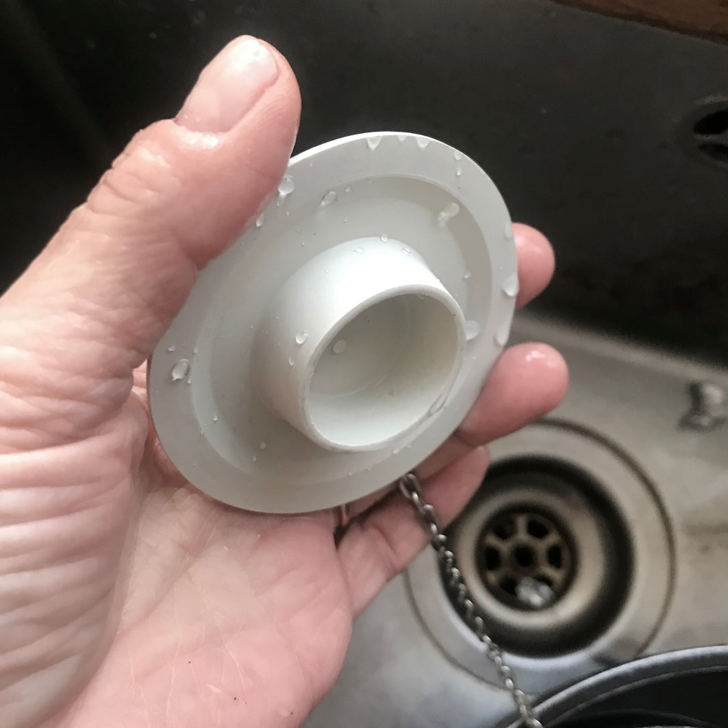 Universal bath and sink plug