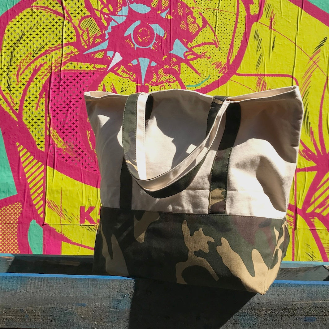 Canvas tote shopper bag with camouflage details bright background graffiti