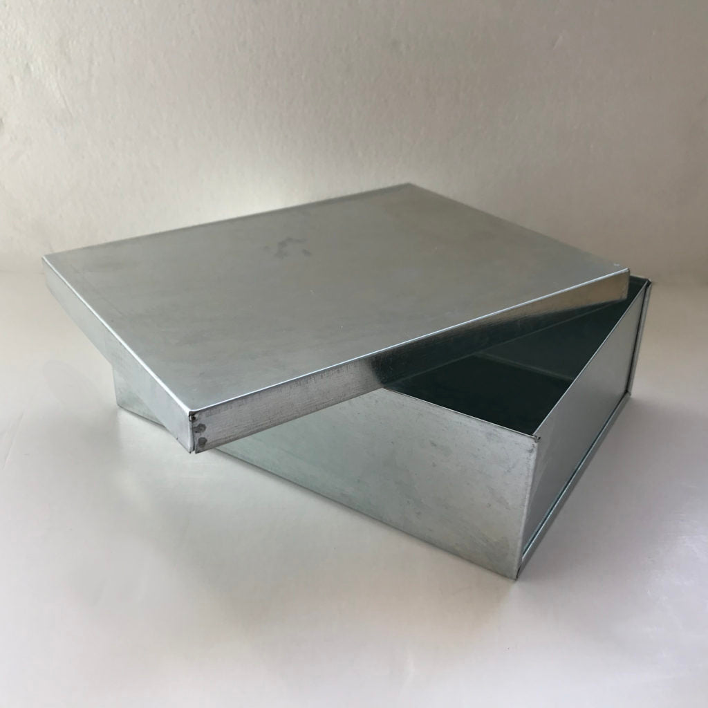 Galvanised metal storage box with lid open