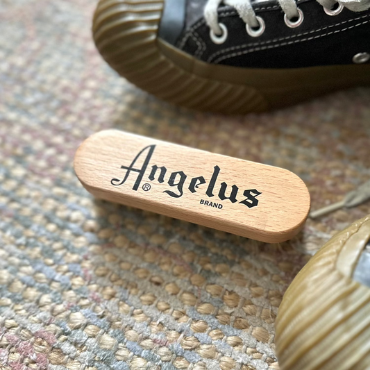 Angelus_brand_sneaker_trainer_brush on a carpet with sneakers
