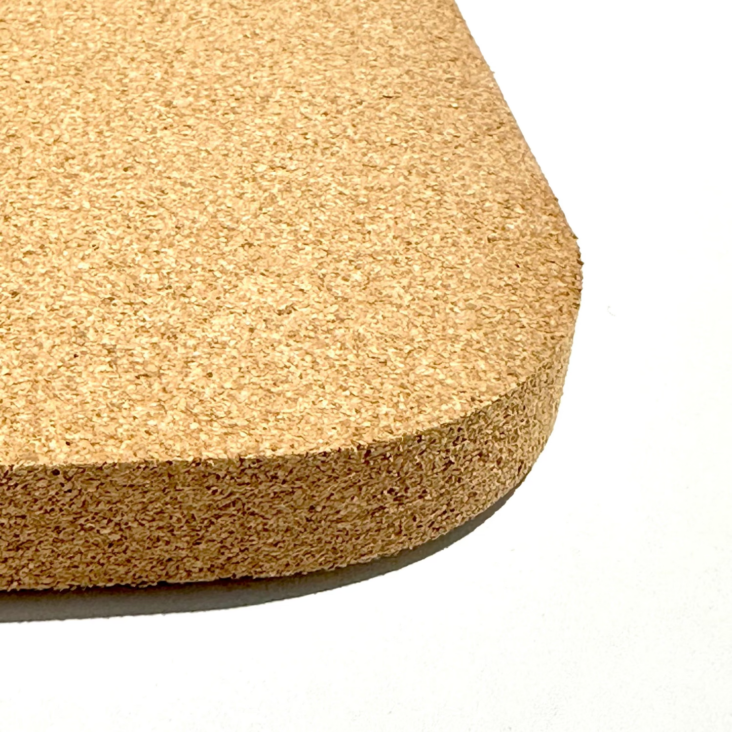 Cork bathmat on a white background