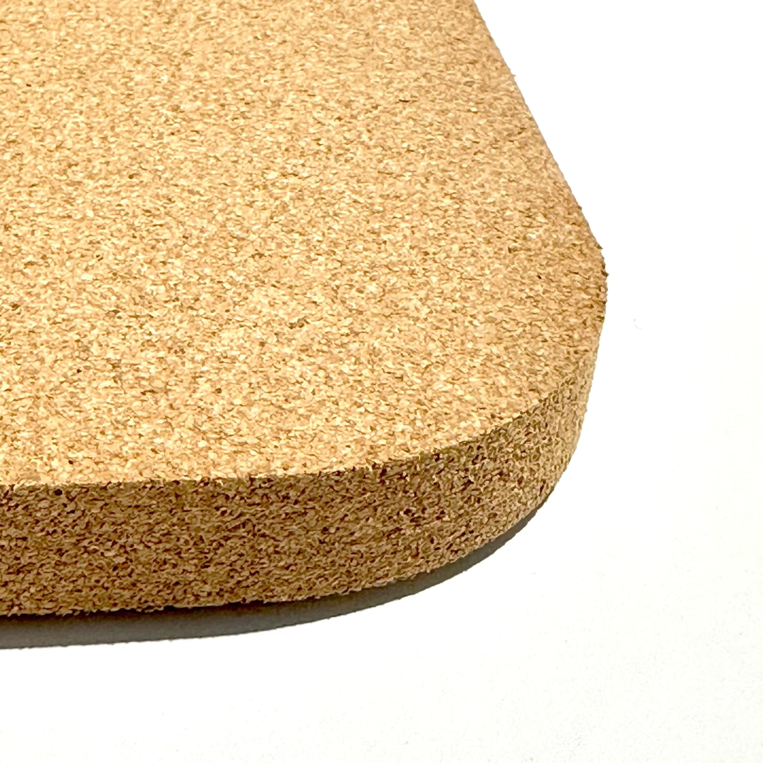 Cork bathmat on a white background