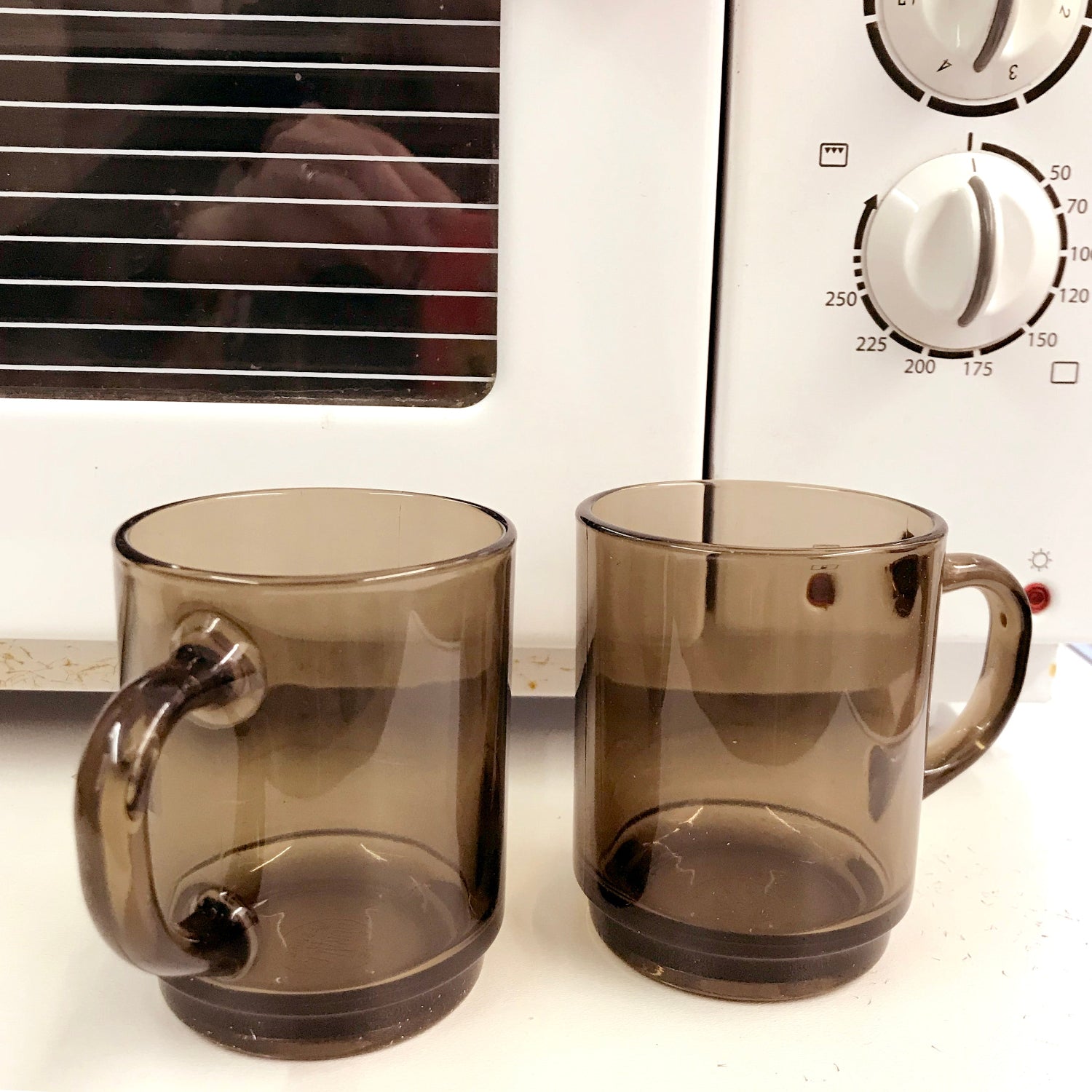 Duralex mugs in front of a microwave oven