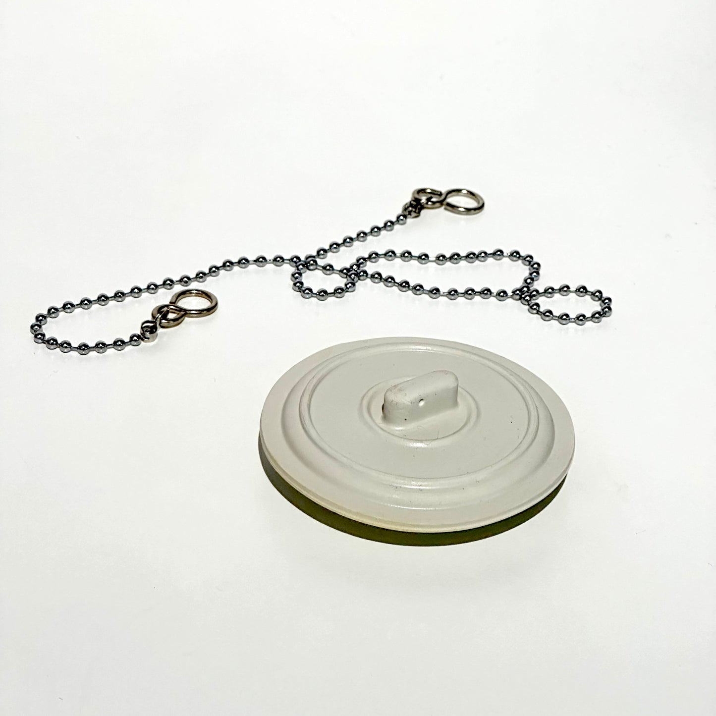 Universal bath and sink plug