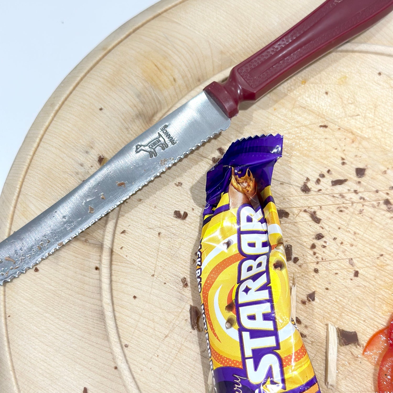 Knife on a board with star bar wrapper