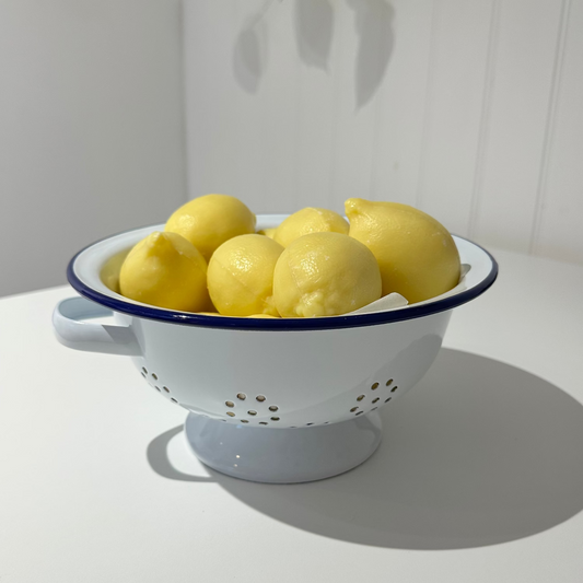 Lemon soaps in a colander