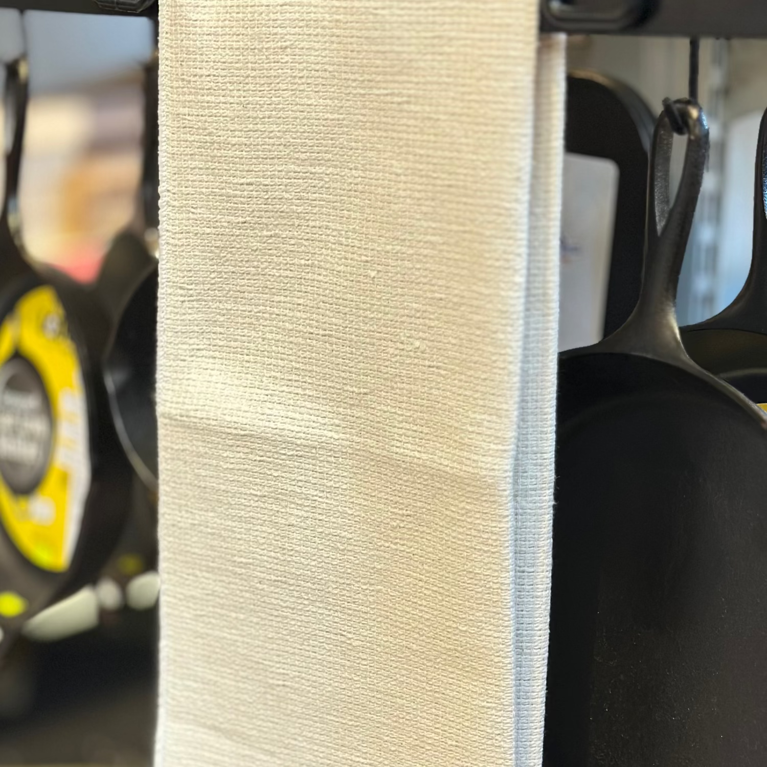 woven oven cloth folded over rail