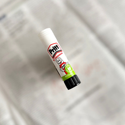 Glue stick on blurred background