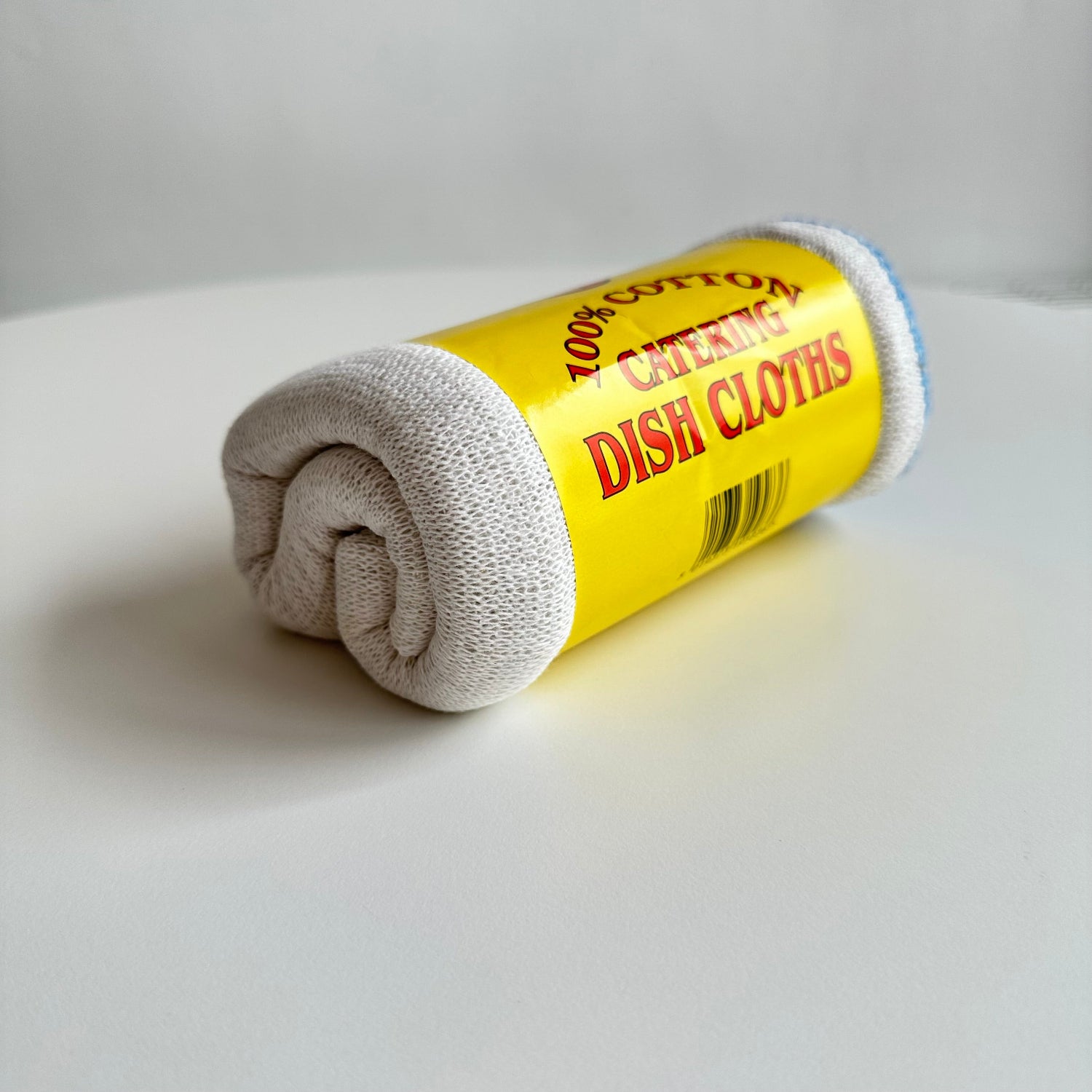 Detail of roll of dish cloths white background