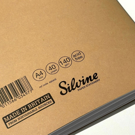 Brown notebook with 'Silvine' branding and product details on a white background