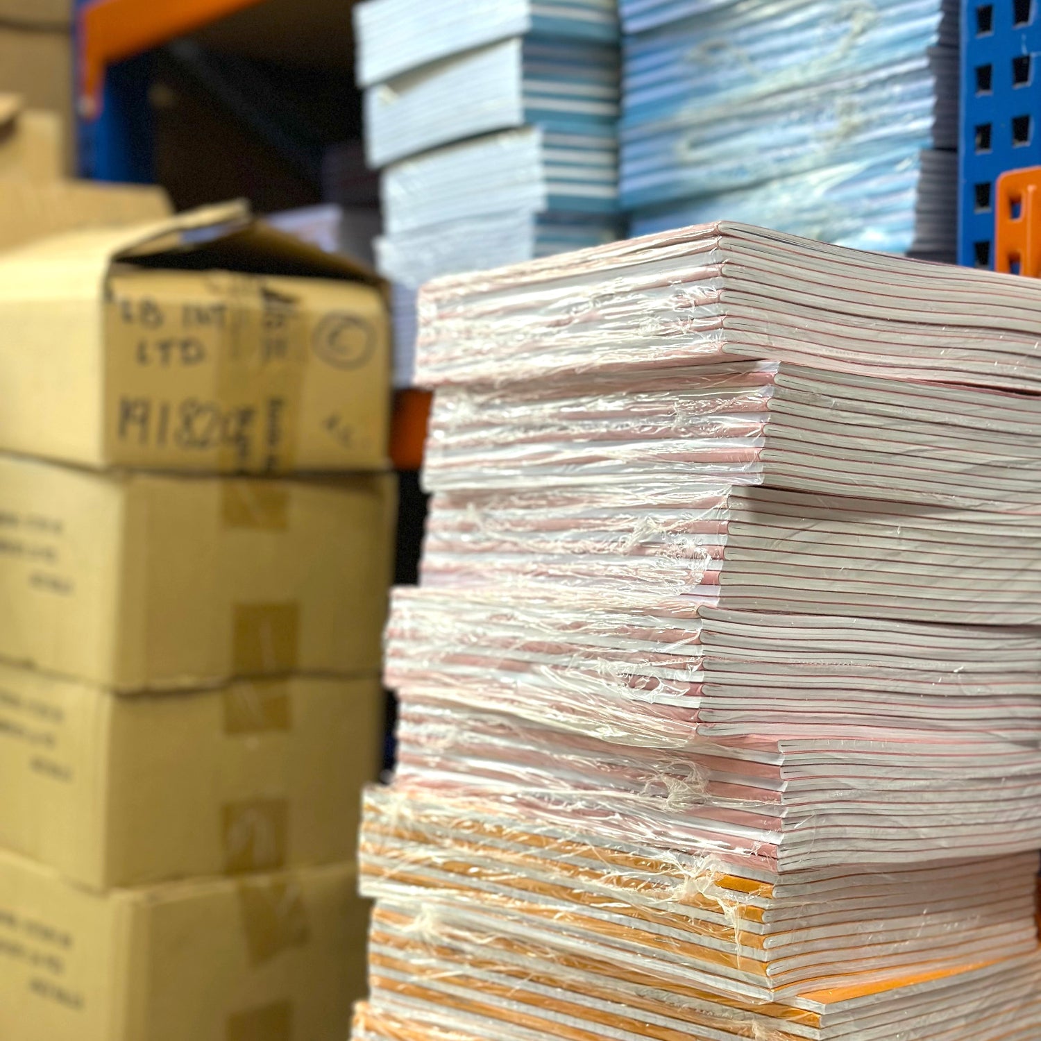 Stacks of paper and cardboard boxes in a warehouse setting