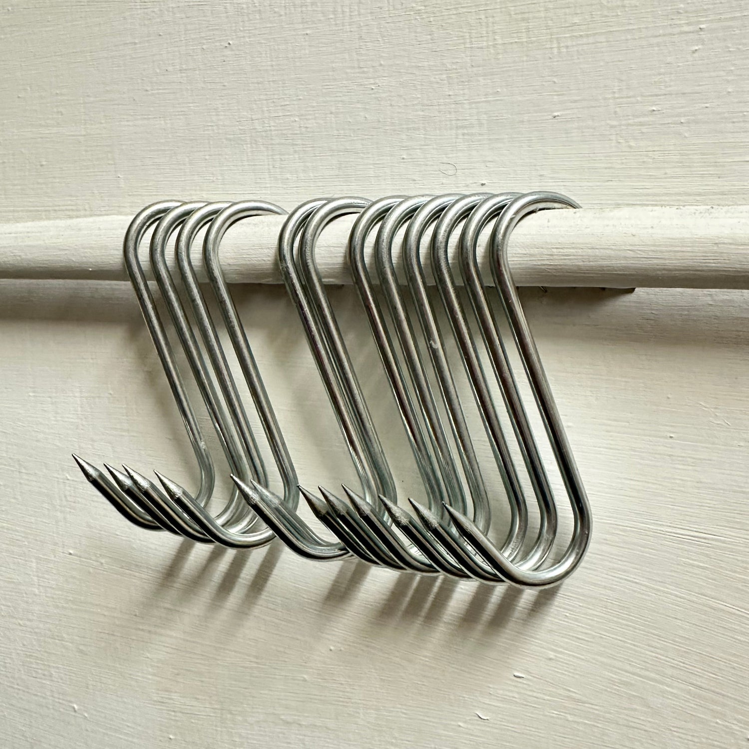 Steel S hooks butchers hooks on rail