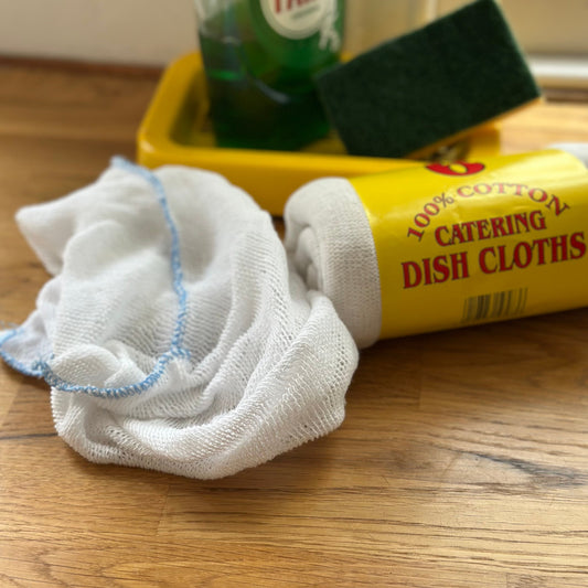 Dish cloth and packaging by sink
