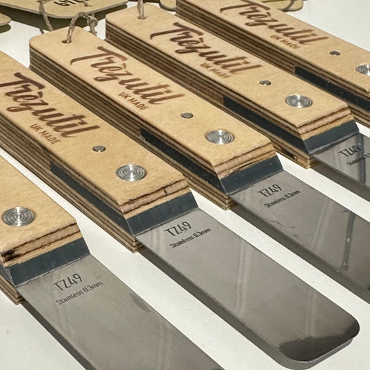 Row of scrapers with wooden handles