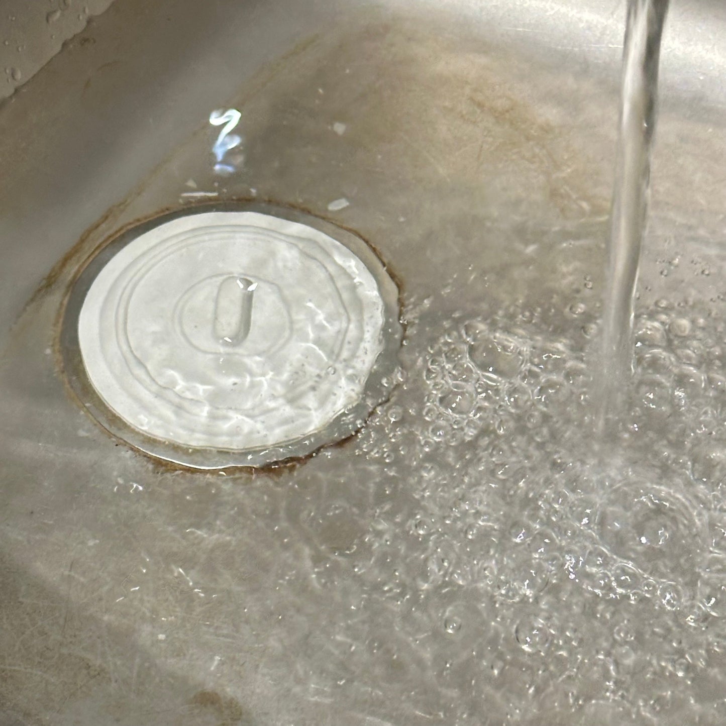 Universal bath and sink plug