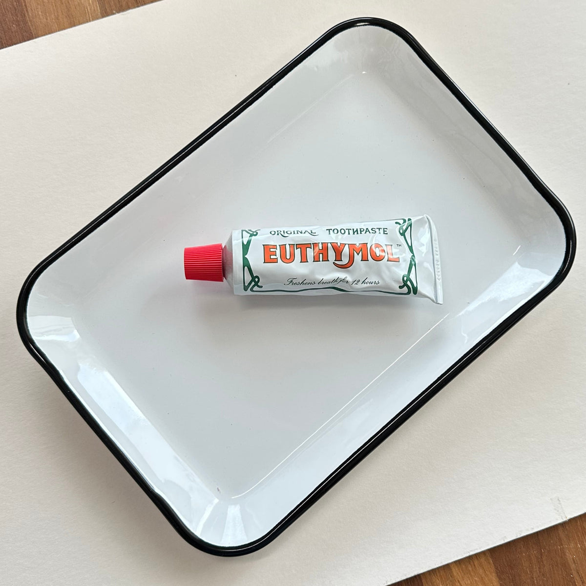 Utility enamel tray with toothpaste