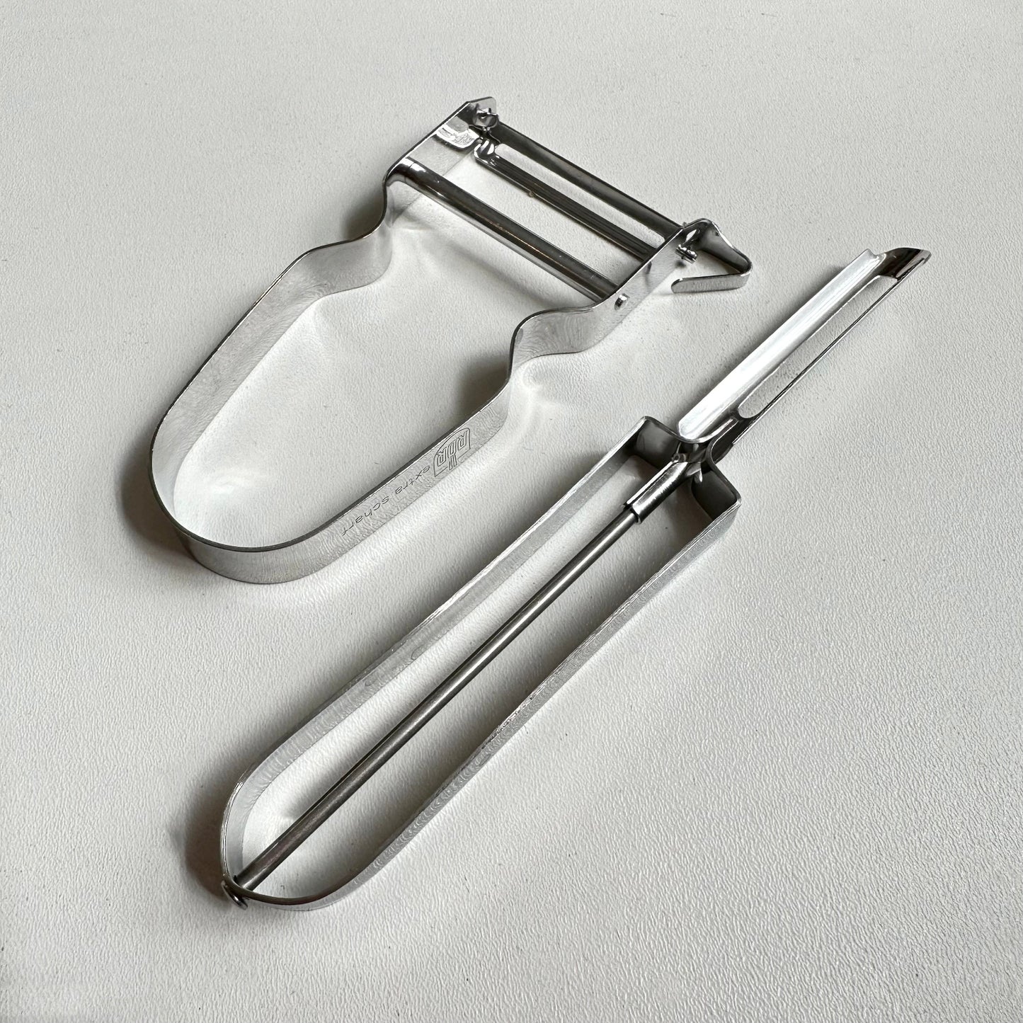 Vegetable peelers on a white background