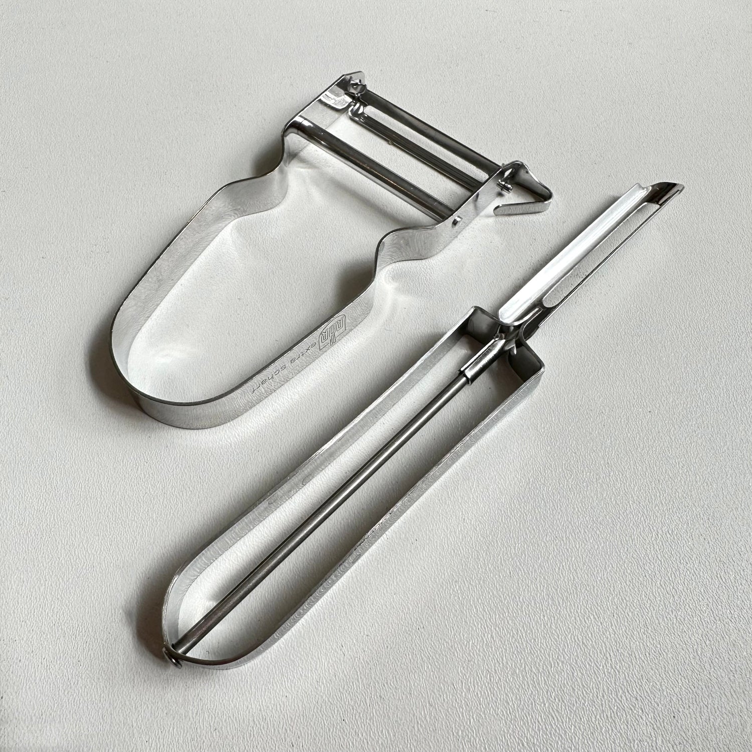Vegetable peelers on a white background