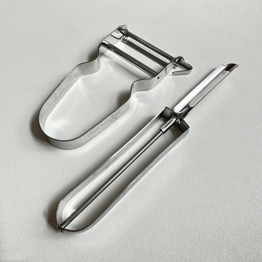 Vegetable peelers on a white background