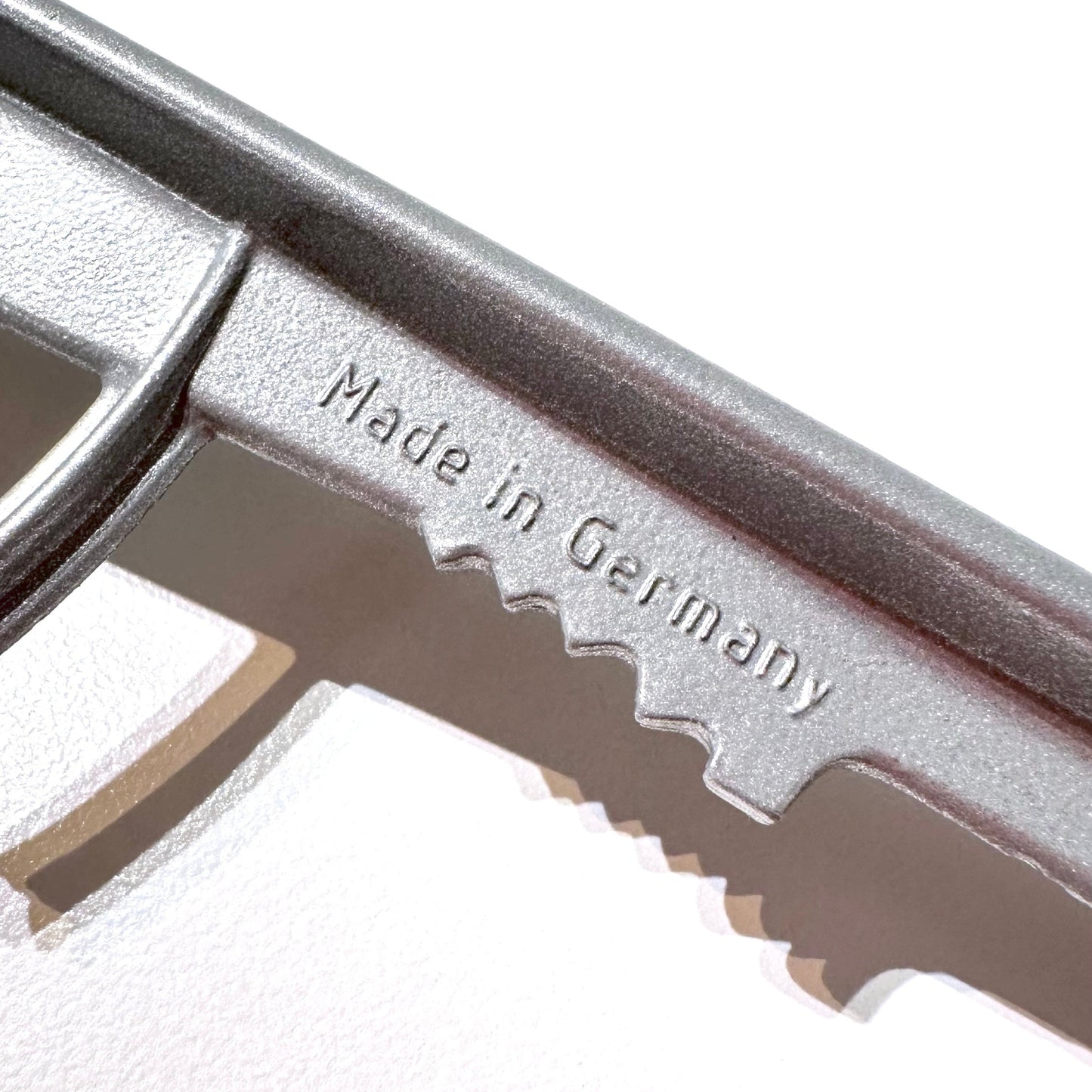 Metal tool with 'Made in Germany' engraving on a white background