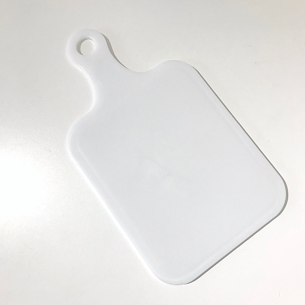 White plastic chopping board with handle