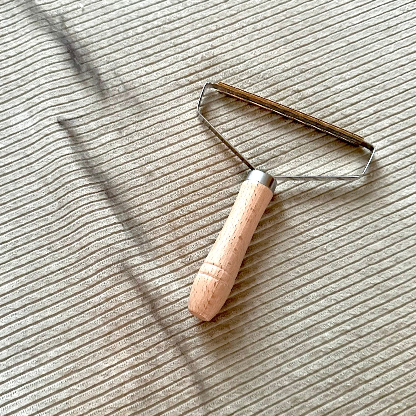 Lint remover on beige background
