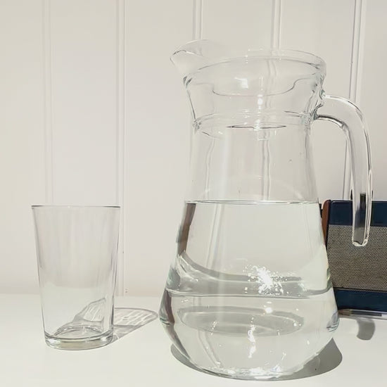 Arc glass water jug pouring into Duralex glass