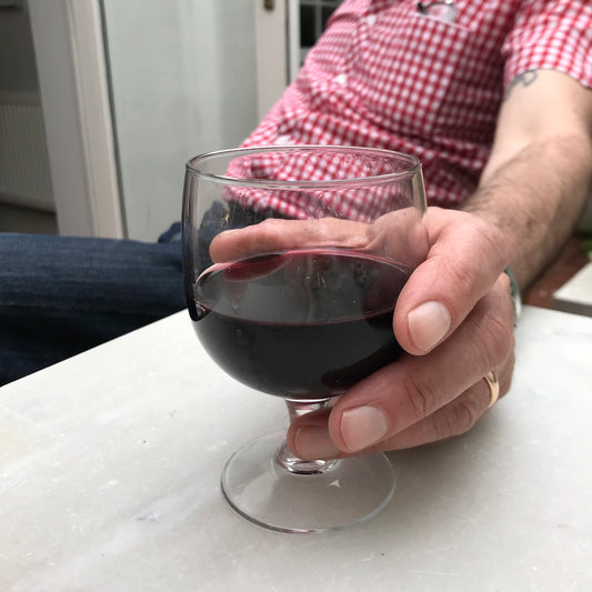 Arc stacking wine glass red wine hand