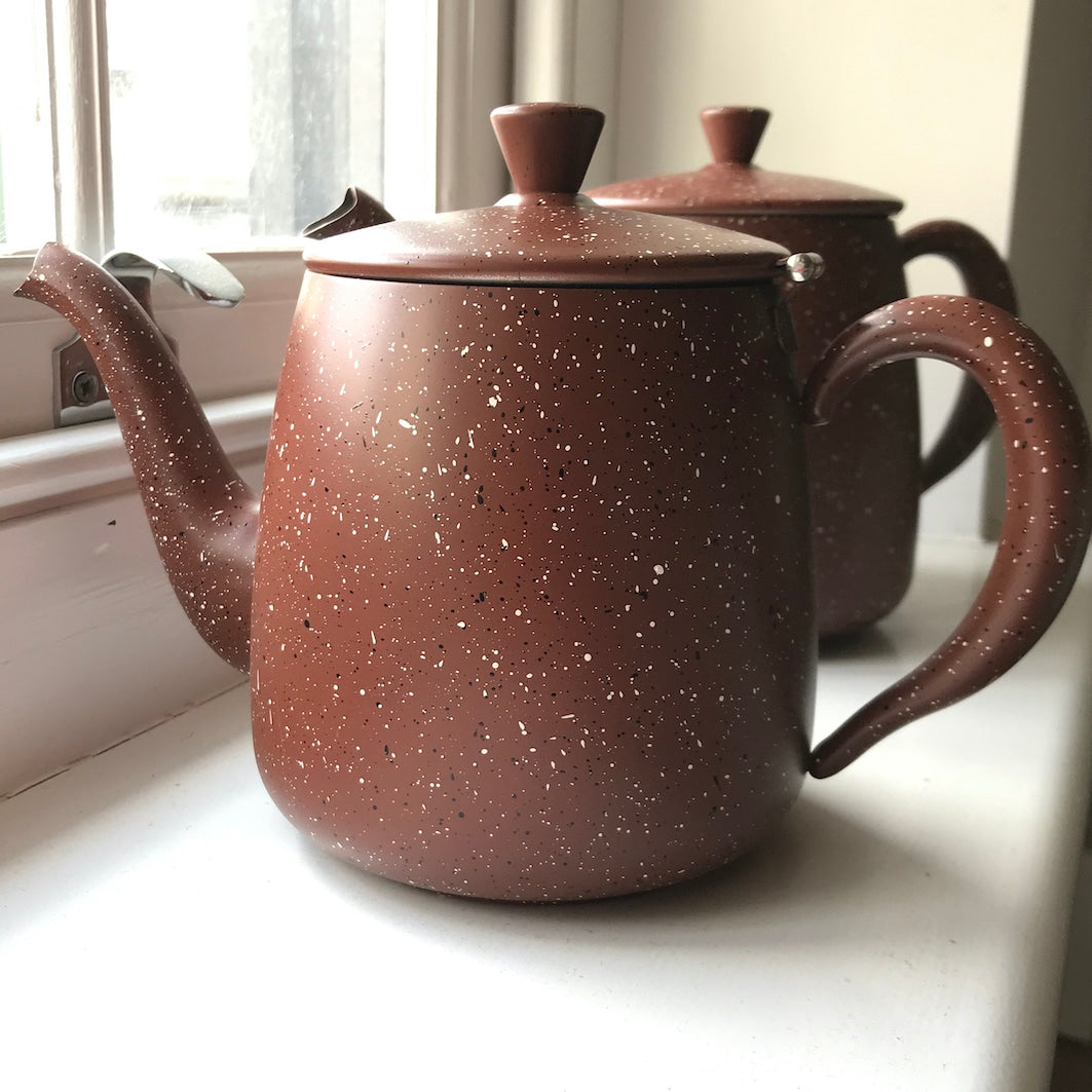 Brown speckled teapots windowsill 2
