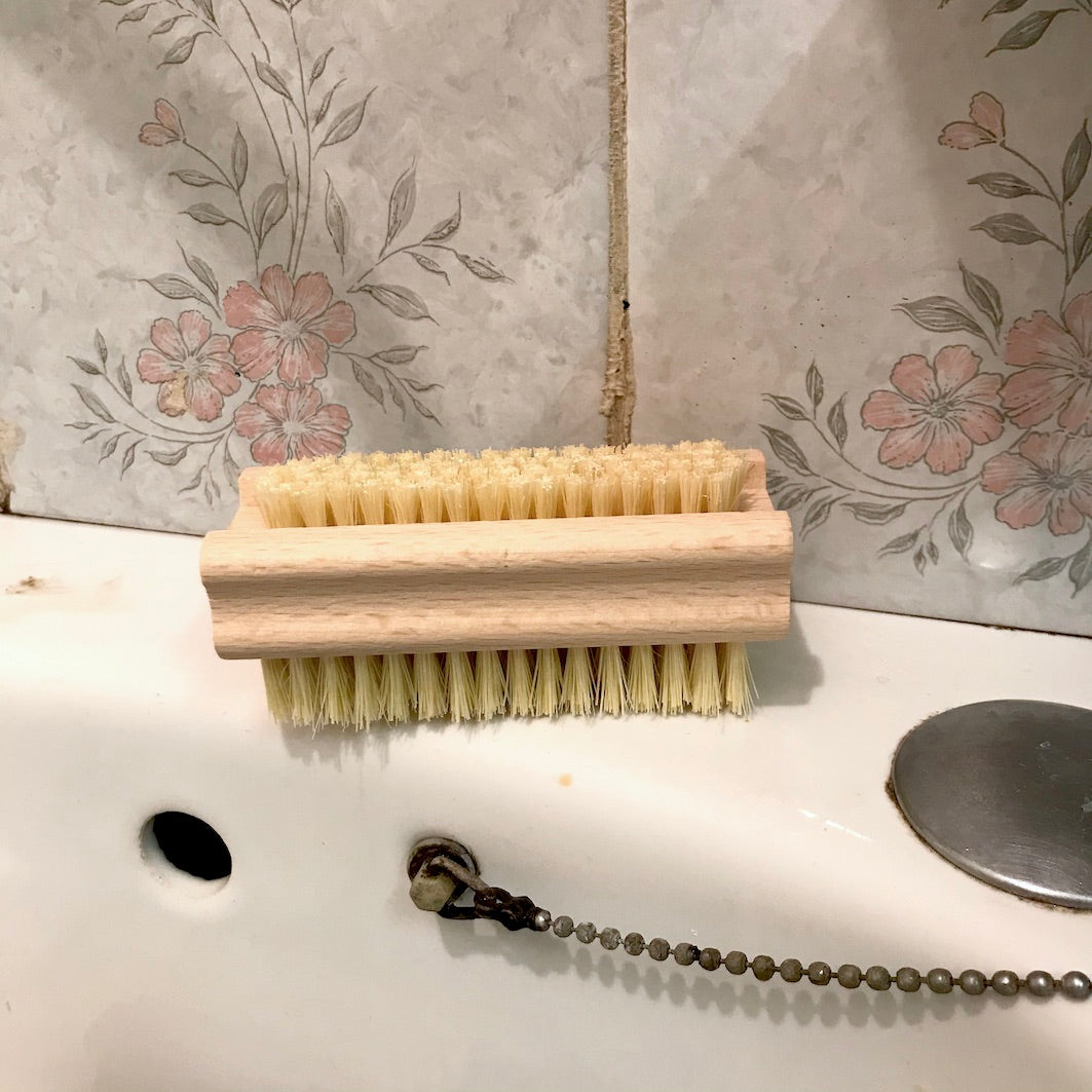 Nailbrush by sink