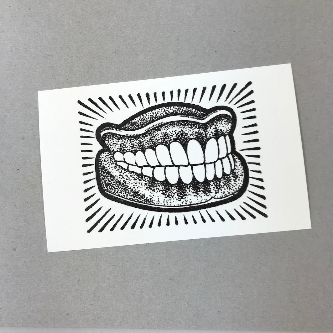 Post card false teeth