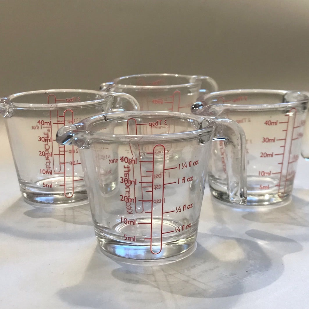 Tiny measuring jugs four