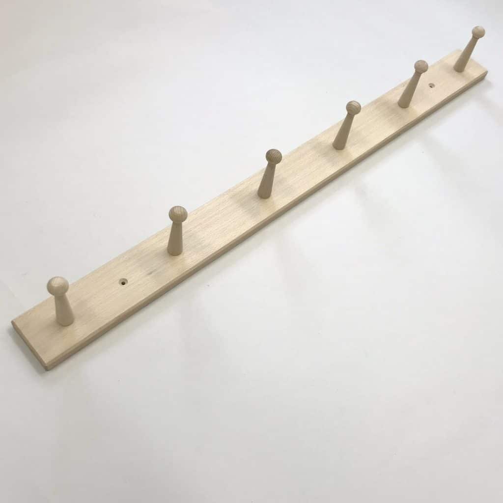 Wooden peg rail