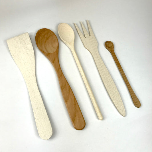 Wooden spoons and utensils line up